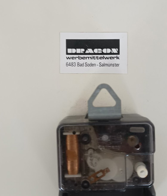 Image 1 of 1970s wall clock with advertising