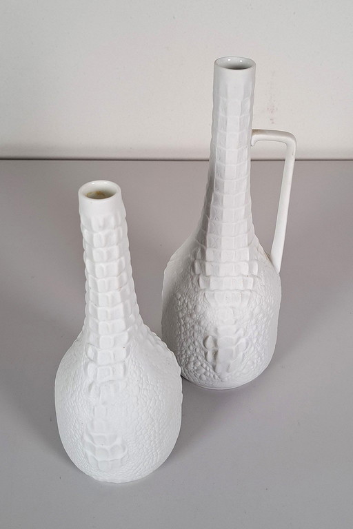 Pair of biscuit porcelain vases