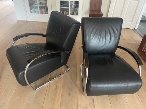 Set of Molinari Lounge chairs, black leather with chrome and black wood armrests.