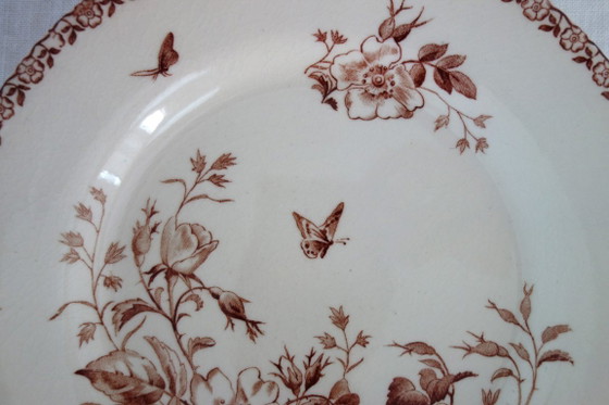 Image 1 of 11 assiettes plates Terre De Fer Gien modèle Mai vers 1900