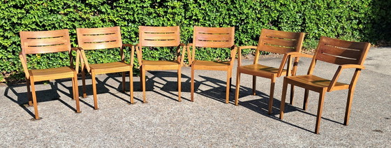 Image 1 of 6 Traditional Teak stacking chairs with armrests