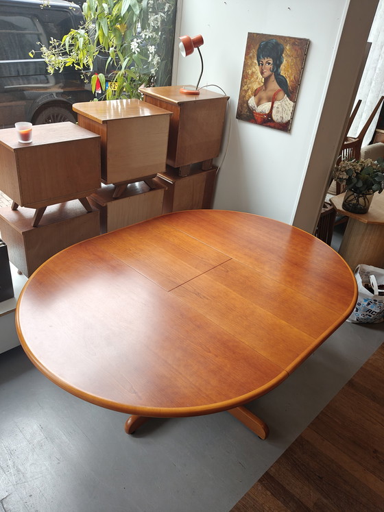 Image 1 of Extendable round to oval dining table