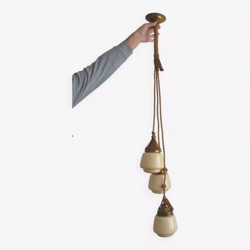 Art Deco chandelier composed of 3 honey opaline glass globes and passementerie