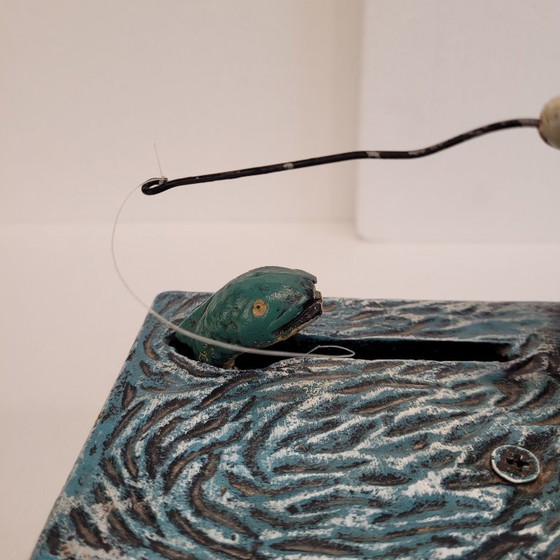 Image 1 of "Fisherman" piggy bank with fishing mechanism, cast iron, 1950s - USA.