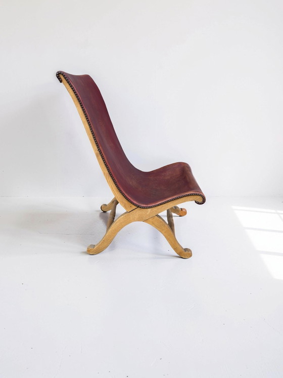 Image 1 of Slipper chair van rood leer van Pierre Lottier voor Valenti