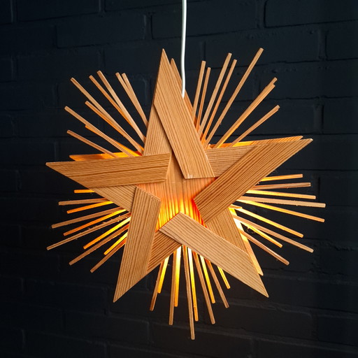 Vintage wooden Christmas star Advent star with lighting