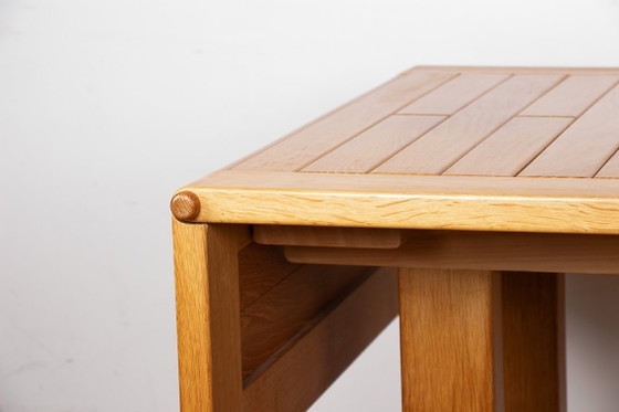 Image 1 of Gran mesa de comedor extensible de roble macizo, diseñada por Guillermo y Chambron en 1960.