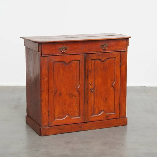 Antique cabinet in a red / brown color with 2 doors and a drawer