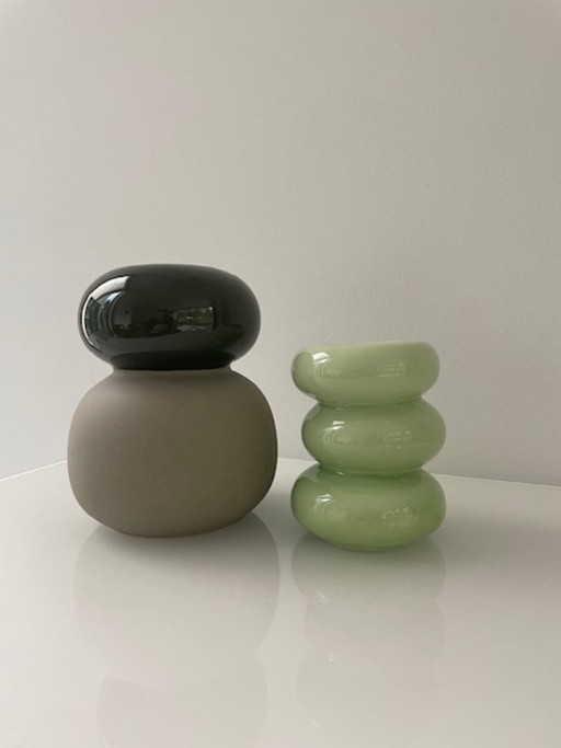 Set of 2 sculptural design vases in green and taupe