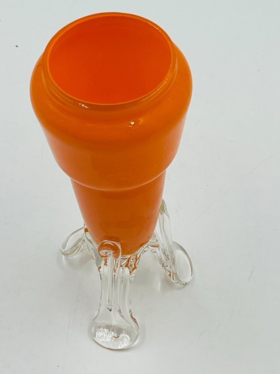 Image 1 of Vintage orange glass bud vase with a sculpted base