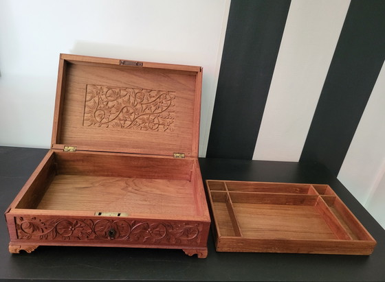 Image 1 of Hand-engraved wooden jewelry box with peacock and floral motifs.