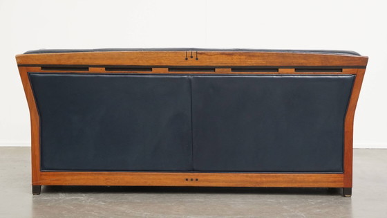 Image 1 of 2.5-zits Art Deco design bank van Schuitema met houtwerk en donkerblauw rundleer