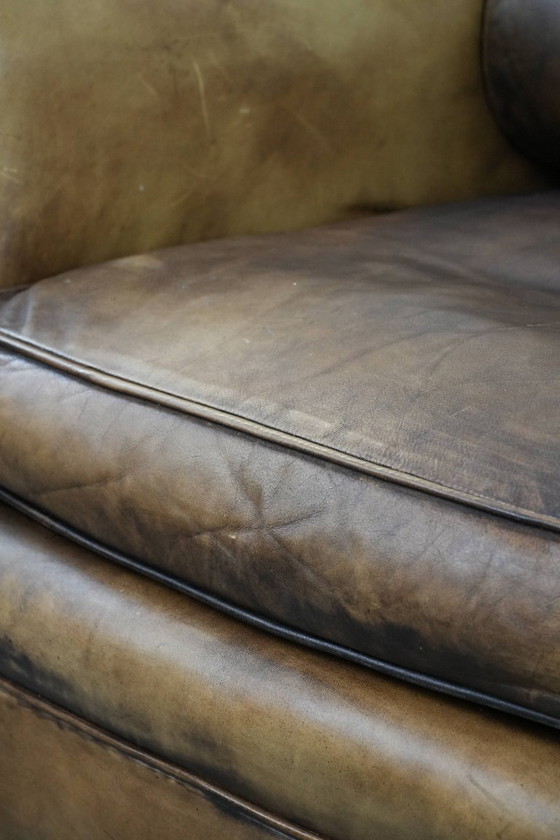 Image 1 of Ohrensessel im englischen Stil aus Kuhfell