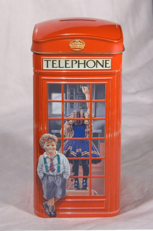 Metal money box in the shape of an English telephone box, formerly a Churchill's Jelly Beans candy tin, 1990s, 7x