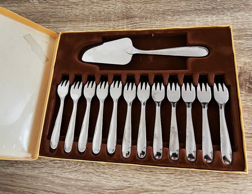 Box of 12 stainless steel forks and 1 dessert server by Devouge Dupont silversmiths