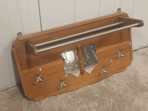 Vintage wooden coat rack with butterfly mirror