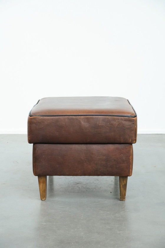 Image 1 of Vintage sheepskin stool with black piping