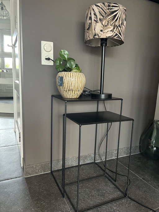 2 black metal side tables