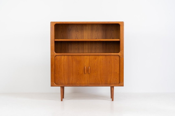 Image 1 of Bookcase in teak by Svend Dyrlund with tambour doors (Denmark, 1960s).