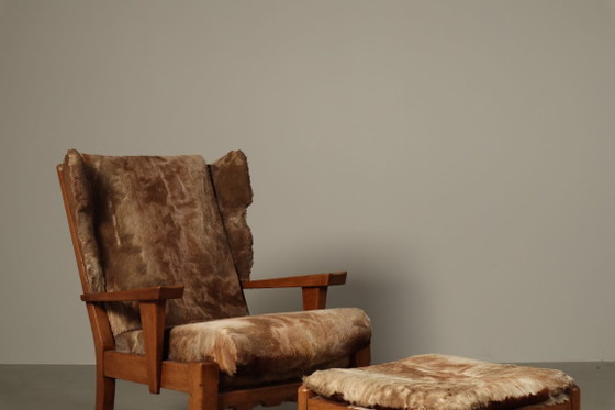 Brutalist oak lounge armchair and ottoman in original goat hide, 1960s – Wood (photo 10 of 15)