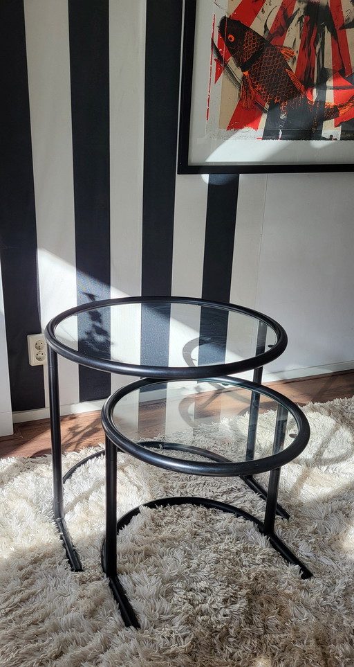 Post-Modern tubular frame nesting tables in black.