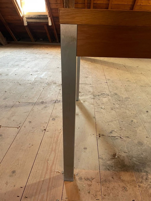 Simple modern, sleek oak table with stainless steel legs