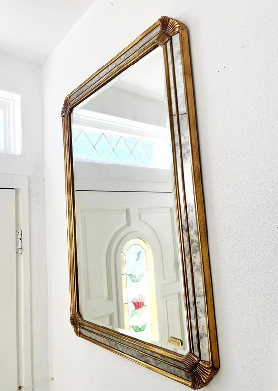 Image 1 of Vintage Deknudt trapezoid mirror – gold frame with smoked mirror glass – Hollywood Regency style – 95 × 69 cm
