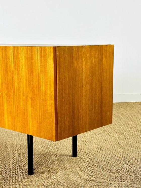Image 1 of Minimalist Scandinavian sideboard in teak with black metal legs, 1960