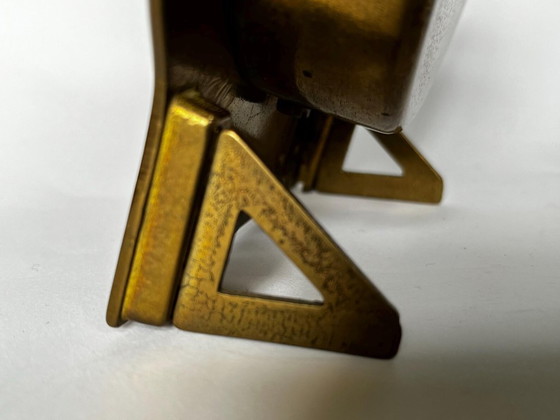 Image 1 of Mid-century brutalist brass zodiac desk clock met datumkalender – 1960s West Germany