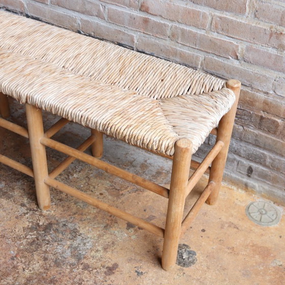 Image 1 of https://www.meutt.nl/a-109283495/fauteuils-stoelen/vintage-oud-bankje-rieten-zitting-hal/