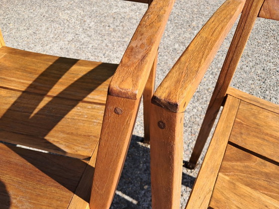 Image 1 of 6 Traditional Teak stacking chairs with armrests