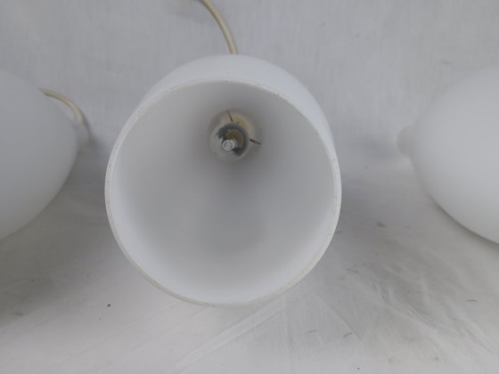 Image 1 of Elegant and timeless, this set of three original Holmegaard glass pendant lamps