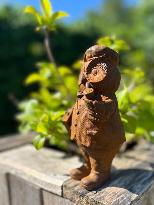 Cast iron owl with pipe and book