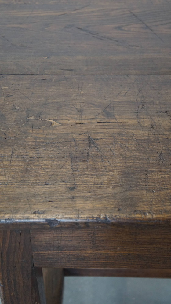 Image 1 of Antique early 19th century French dining table made of oak with 1 drawer