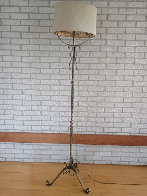 Elegant adjustable wrought iron floor lamp