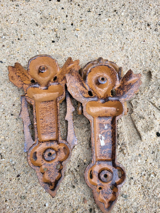 2 cast iron door knockers shaped like angels