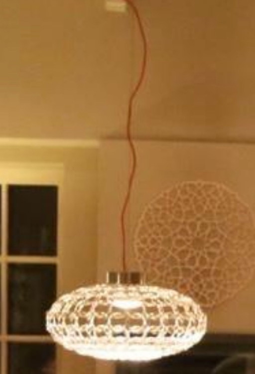 Découvrez l'art de la lumière : la suspension ovale Terzani GRA