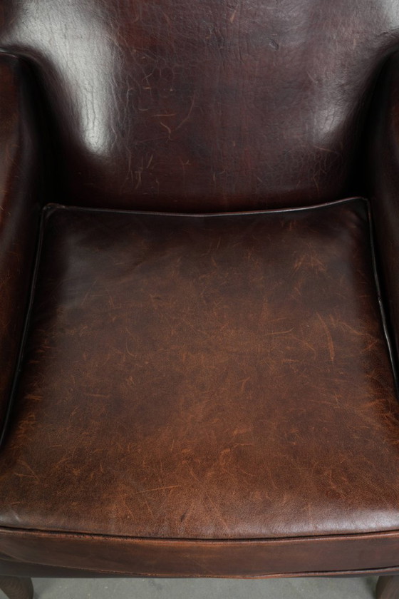 Image 1 of Poltrona di design in pelle di pecora in buone condizioni, con un bellissimo colore intenso e una seduta confortevole.