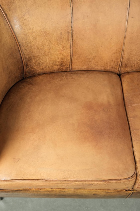 Image 1 of Karaktervolle schapenleren 2 zits bank met een mooie vintage look