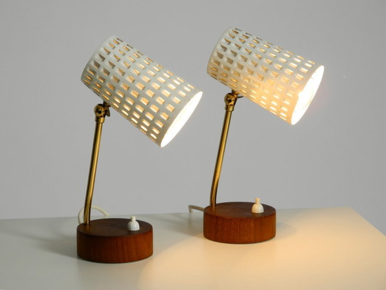 Image 1 of A pair of beautiful mid-century modern bedside lamps with perforated metal shades and teak wood bases