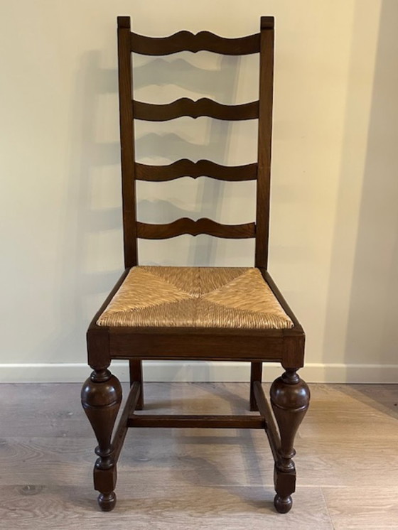 Image 1 of 2 grote + 6 kleine eiken stoelen