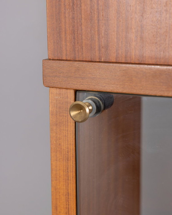 Image 1 of GROTE VINTAGE ITALIAANSE ONTWERP HOUTEN CENTRALE DRAAIBARE BOEKENKAST UIT DE JAREN 60