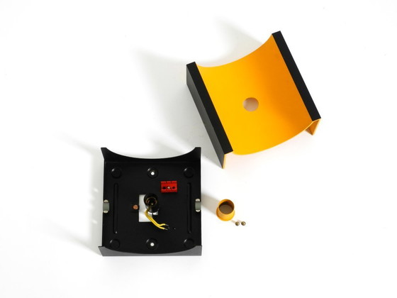 Image 1 of A rare pair of original 1960s Space Age metal wall lamps by Klaus Hempel for Kaiser Leuchten in yellow and black