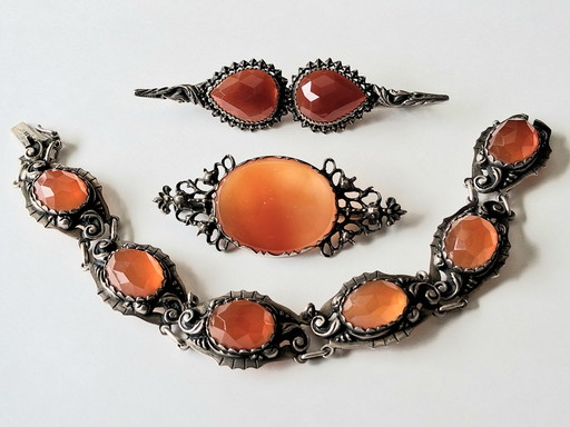 3 antique silver jewelry pieces with faceted Carnelian stones and round-cut Baltic Amber.