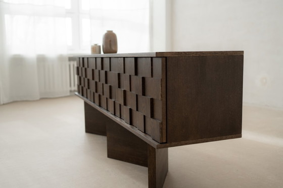 Image 1 of The Noemi chest of drawers is raw, minimalistic and uncompromising in its form.