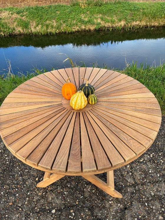 Image 1 of Round folding heavy-duty teak garden table 110cm - as NEW -