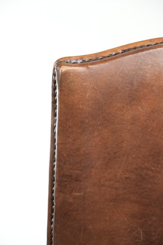 Image 1 of 4 x Vintage eetkamerstoel gemaakt van schapenleer met een hoge rug