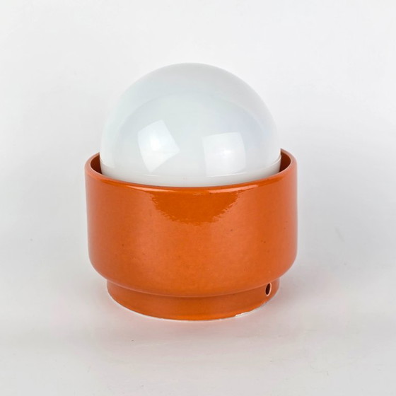 Image 1 of Vintage German ceramic lamp with a glass globe shade. Can be used as a wall lamp, table lamp, or sconce. Orange. 70s / retro