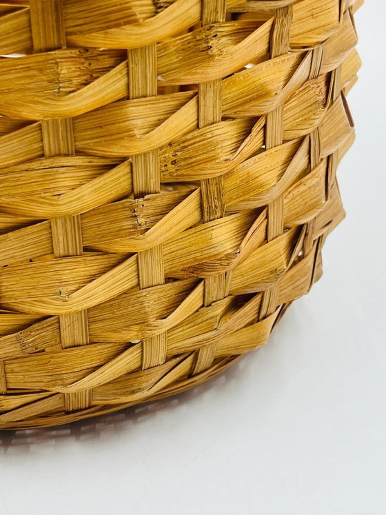 Image 1 of Cache pot vintage en osier tressé