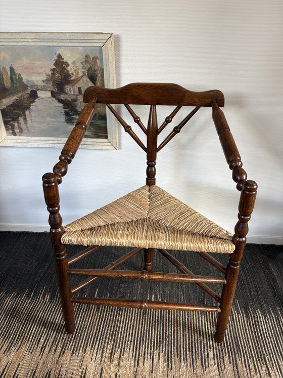 Image 1 of  Vintage Antiek 20ste eeuw eiken hoekstoel met biezen zitting h85cm